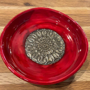 Red pie plate with gold accents