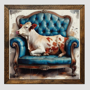 Framed Print of Calf on Vintage Sofa