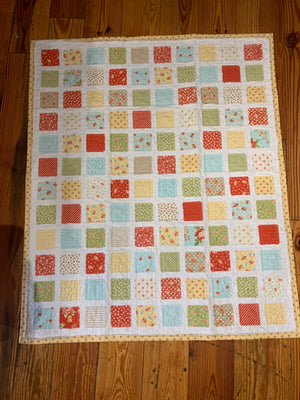 Colorful square baby quilt