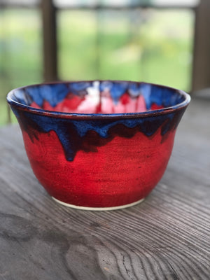 Red bowl with blue drip edge